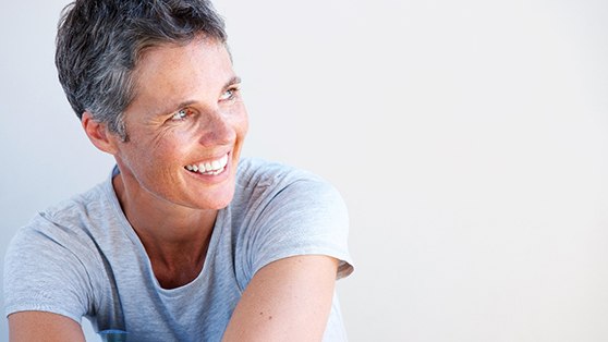 middle aged woman with short hair smiling 