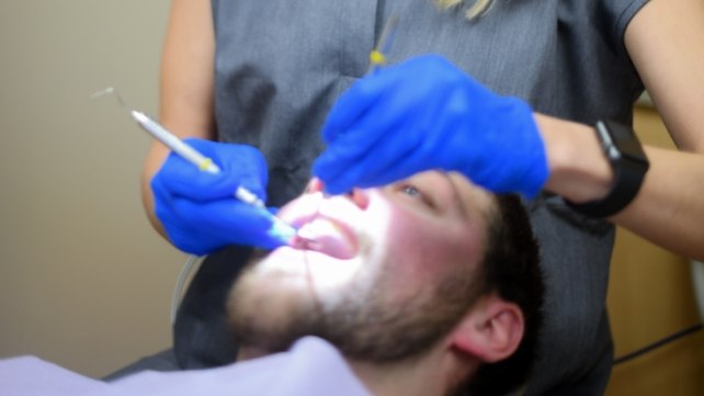 Dental patient receiving diode laser therapy