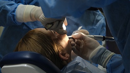 Woman getting oral surgery