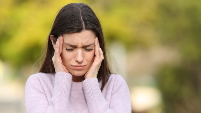 Woman having BOTOX® injected in forehead