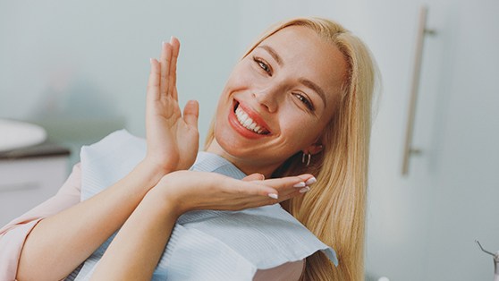 Happy dental patient showing off her smile