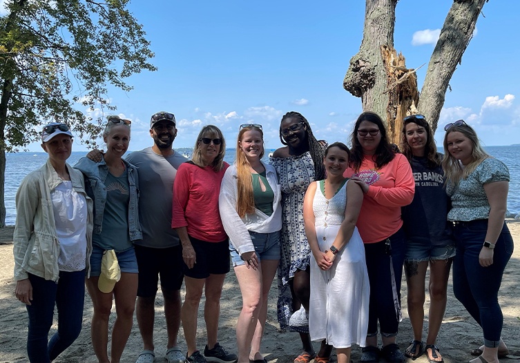 Elevate Dental team smiling on the beach