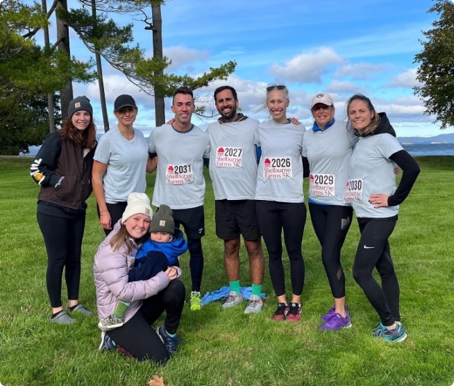 Dental team members wearing number stickers for 5 K race