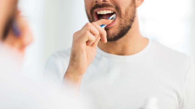 Man brushing his teeth