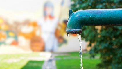 Water flowing out a sink faucet