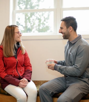 Dentist and patient discussing dental treatment options