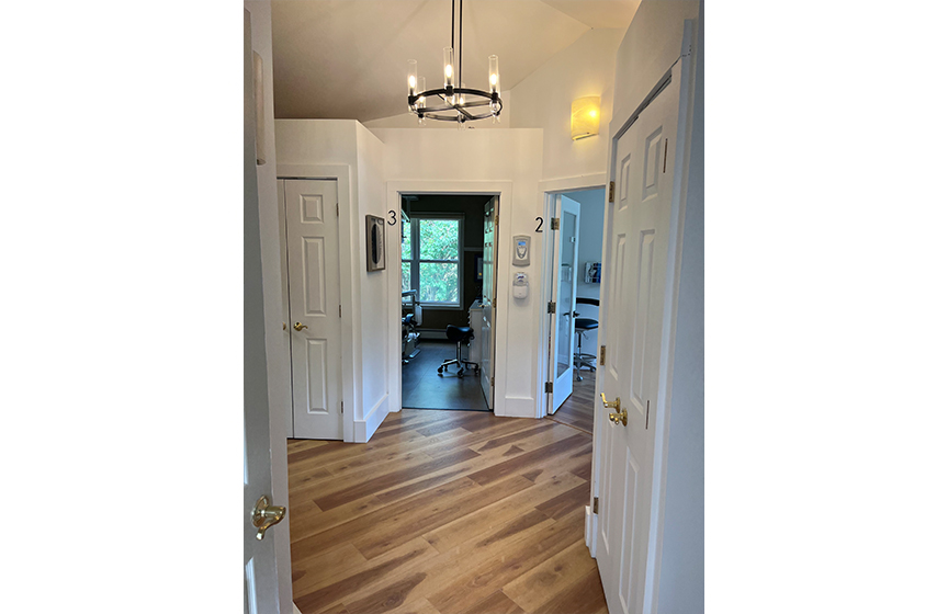 Hallway branching off into several dental treatment rooms