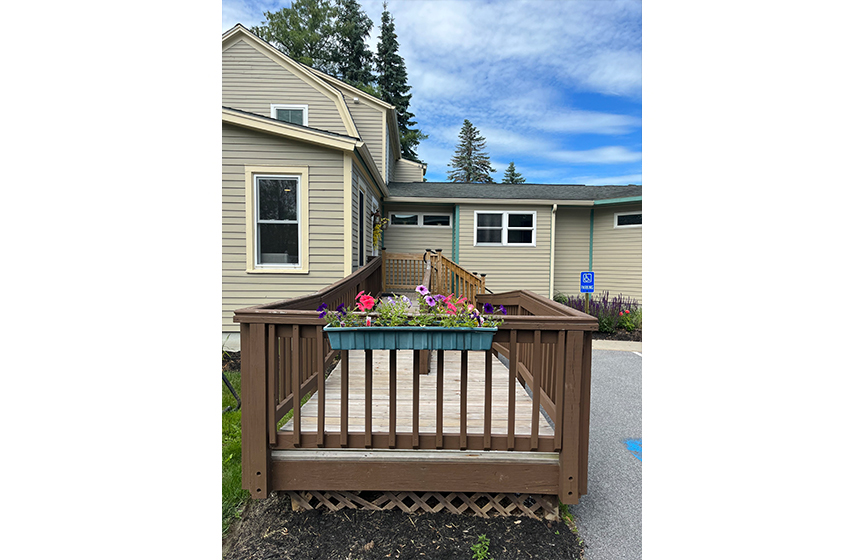 Wooden walkway leading to dental office front door