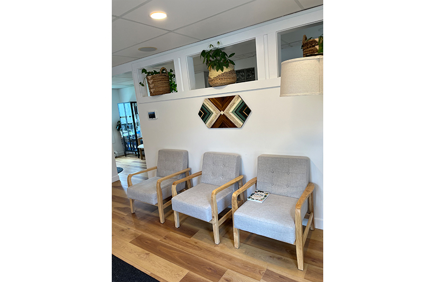 Table and chairs in dental office reception area