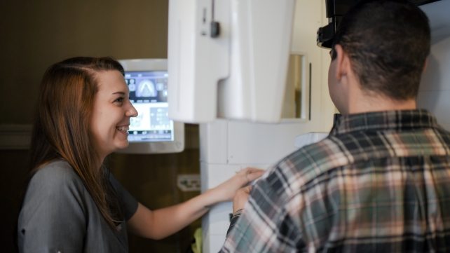 Dental patient receiving digital x ray scans