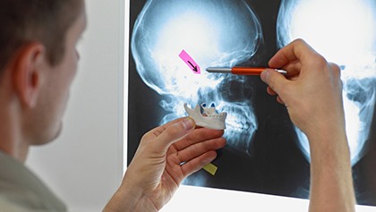 A dentist examining a patient's teeth
