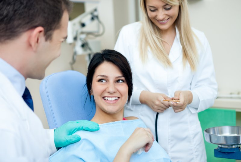 patient talking to their dentist