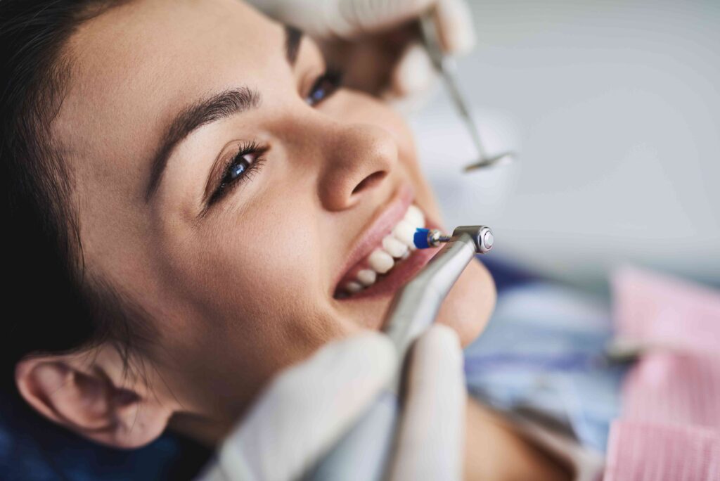 Woman having her teeth cleaned